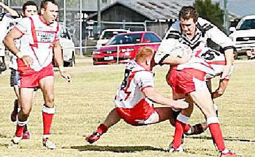 Killarney Cutters Mick Bowman and Chris McGregor tackle Texas Terriers Troy Moffit in the Cutters 32-18 loss at Charlie Andrews Oval. Killarney Cutters Mick Bowman and Chris McGregor tackle Texas Terriers Troy Moffit in the Cutters 32-18 loss at Charlie Andrews Oval.